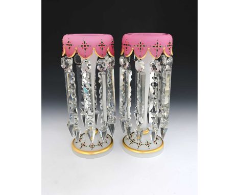 A pair of jewelled pink blush satin opaline glass lustres footed trumpet form with turned rims, denticulated and applied with