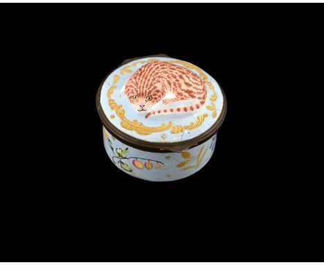 A relief modelled Bilston enamel patch box, circa 1780, circular form, the lid with a ginger marmalade cat within raisted gil