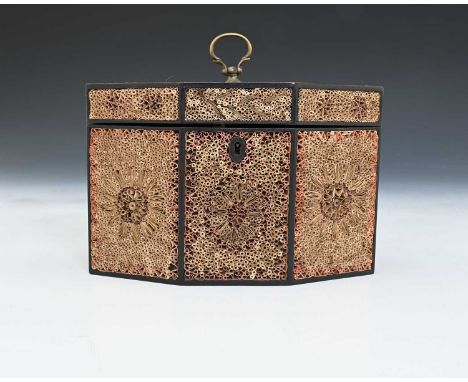 A George III quill work or rolled paper tea caddy, circa 1790, of octagonal form, hinged cover with a brass ring handle, each