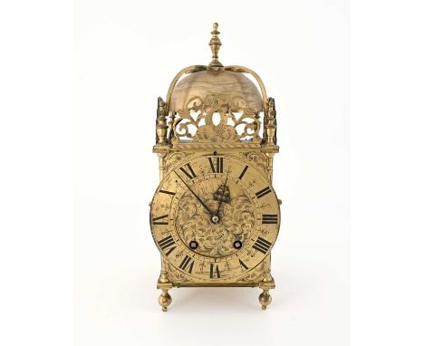 A traditional brass lantern clock, 19th Century in the 17th Century style, urn finial, bell, fretwork panels to three sides, 