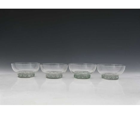 Rene Lalique, four Dampierre glass bowls, model 3136, designed circa 1932, polished and frosted with green staining, etched m