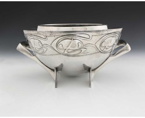 Archibald Knox for Liberty and Co., a Tudric Arts and Crafts pewter bowl, model 0229, shouldered parabolic domed form, on bla