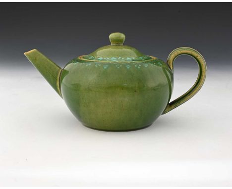 Ruskin Pottery, a Souffle and slip decorated teapot, circa 1900, quat ovoid form, green tocky glaze wiith bands of grape vine