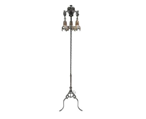 Alessandro Mazzucotelli (Italian, 1865- 1938), a wrought iron standard lamp, circa 1910, the twisted column supporting a pier