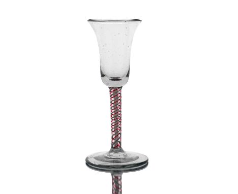 A colour twist and opaque wine glass, circa 1765, probably Dutch, the bell shaped bowl on a double series red and opaque stra