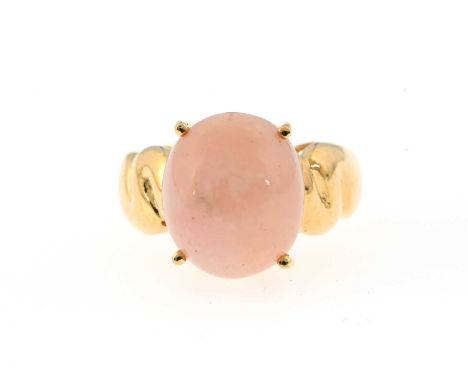 An 18ct gold pink opal cabochon single-stone ring, opal measures approximately 14 by 12mm, hallmarks for Birmingham 2006, rin