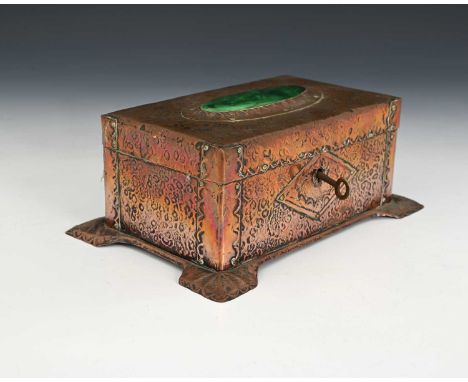 An Arts and Crafts copper and Ruskin set casket, planished and riveted strap design, on wide repousse embossed bracket pad fe