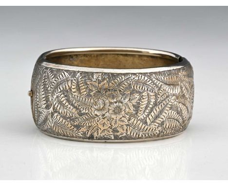 A late Victorian silver foliate and floral engraved bangle bracelet, hallmarks for Birmingham 1880, inner diameter 6cm, 39.1g