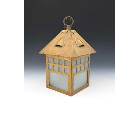 A Glasgow School Arts and Crafts brass lantern pendant light, cuboid house form with pitched roof and embossed rivetted detai