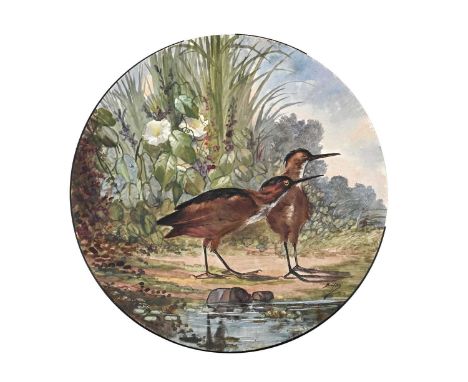 J Buisson for Massier, a faience charger, painted with wetland birds, signed, 51.5cm diameter