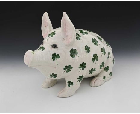 Wemyss for Thomas Goode, a large painted pottery pig, decorated with sprigs of clover, printed mark, 46cm long