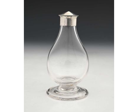 A Gothic Revival silver-mounted glass bottle, in the style of A W N Pugin and James Powell and Sons, of baluster form, atop a