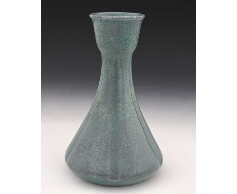 Ruskin Pottery, a textured glaze vase, circa 1900, vertically channeled conical form with tulip mouth, mottled green and purp