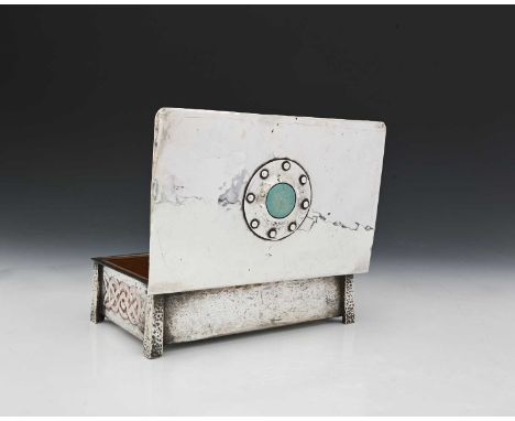 An Arts and Crafts Iona style Ruskin set silver plated casket, probably A E Jones, the hinged lid with a central turquoise ro