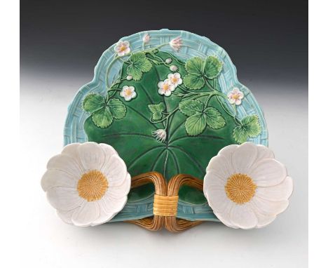 A George Jones majolica strawberry dish, 1876, modelled in relief as a lily pad on basket weave ground with flowering strawbe