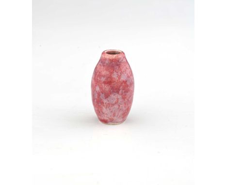 Ruskin Pottery, a miniature Souffle glazed vase, circa 1920s, shouldered barrel form, pink mottled, impressed marks, 4cm high