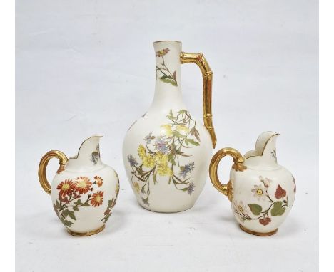 Three Royal Worcester ivory ground jugs, late 19th century, printed green and puce marks, shape nos 1094 and 1132, various pa