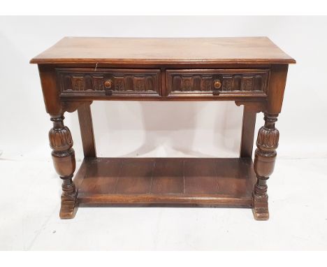 20th century carved stained oak side table in the Elizabethan-style, with two frieze drawers carved with arcaded ornament, on