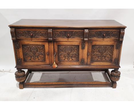 20th century oak sideboard&nbsp;carved in the Elizabethan-style, carved with roses and scrolling acanthus, with three frieze 