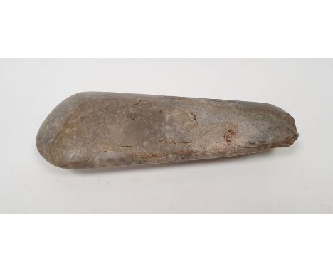 Possibly neolithic polished stone axe head, 18cm&nbsp;Condition ReportSurface scratches, chips to the ends and sides. General