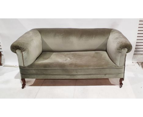 Chesterfield sofa, green upholstered, on turned supports and castors&nbsp;