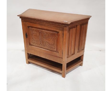 Oak side cabinet, the chamfered sides with linenfold panelling, foliate scroll carved panel to the front of the framed door, 