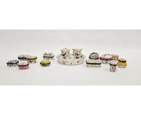 Group of Limoges porcelain gilt metal mounted pill boxes, variously printed and painted with flowers reserved on coloured gro