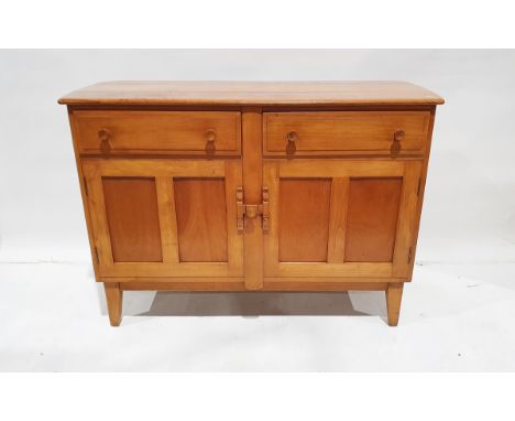 20th century light stained wood sideboard&nbsp;having two frieze drawers, cupboard below enclosed by panelled doors, on taper