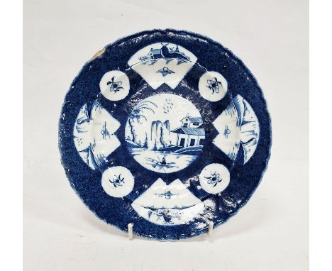 Worcester powder blue ground plate, circa 1765, with Chinese style character marks, painted with chinoiserie landscape vignet