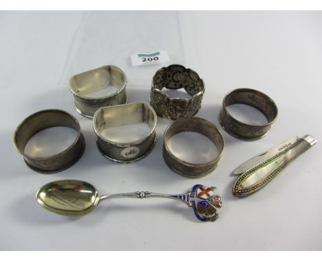 Six hallmarked silver napkin rings approx 3.8oz, mother of pearl fruit knife and commemorative spoon