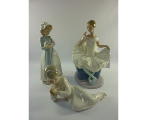 Nao figure of a seated ballerina H25cm, Nao figure of a girl holding a puppy and one other Nao figure (3)