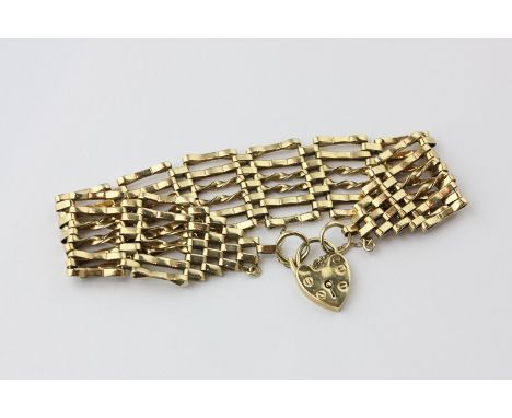A 9ct gold gate link bracelet with padlock clasp, 23.7g