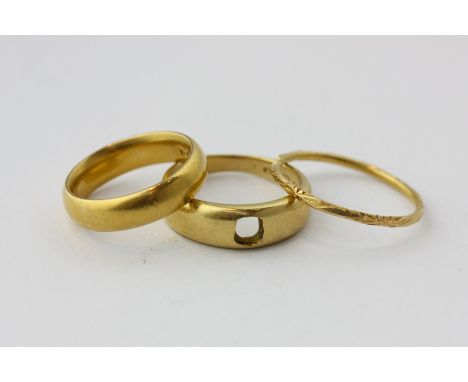 A 22ct gold wedding ring, 7.3g, an 18ct gold ring mount, 6g, an engraved gold band, 1.4g