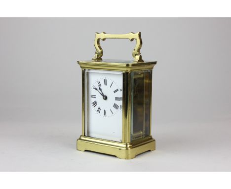 A brass and bevelled glass cased carriage clock with white enamel dial and Roman numerals, maker Duverdry & Bloquel, 14cm