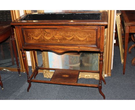 An Edwardian inlaid planter, rectangular form, decorated with swags and urn, on turned supports, with undershelf, 92cm