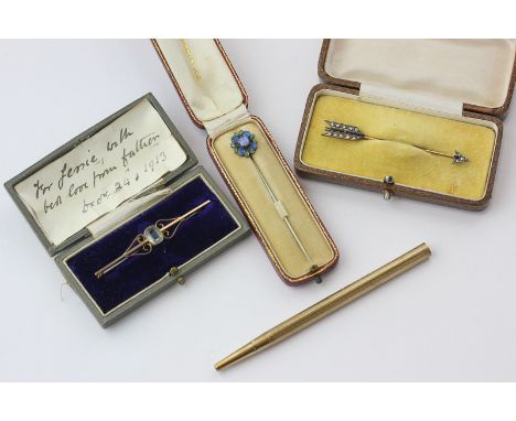 A rose diamond and black onyx Surete pin; an aquamarine bar brooch; an opal and enamel stick pin and a 9 carat gold pencil