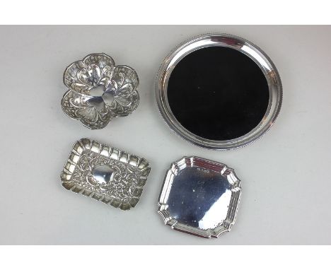 A Japanese white metal mounted circular dish with ebonised wooden base, with calligraphic mark, and three various trinket dis