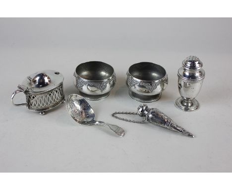 A pair of Victorian silver salts, a George IV silver caddy spoon, a silver mustard (missing liner) a silver pepper and a Vict