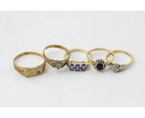 An illusion set diamond single stone ring in 18ct gold, a gem set signet ring a sapphire ring and two other rings