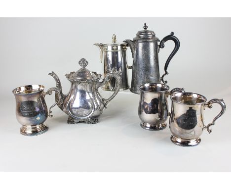 A silver plated teapot, three silver plated mugs (inscribed) and two silver plated jugs