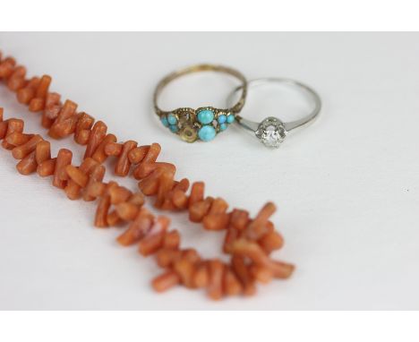 A diamond single stone ring six claw set in 18ct white gold; a 19th century gold and turquoise ring and a coral necklace