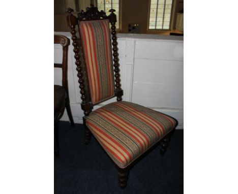 A Victorian nursing chair, with red striped upholstered back, and bobbin turned supports
