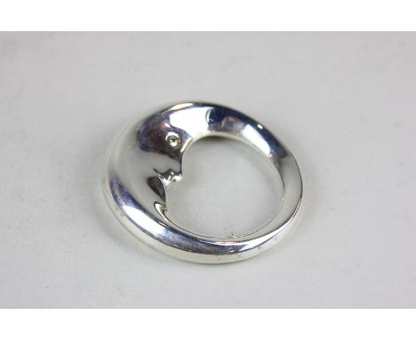 A Tiffany & Co American sterling silver babies teething rattle ring modelled as the man in moon