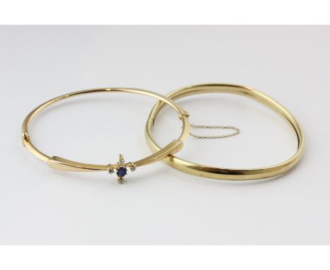 A sapphire and diamond bangle in 15ct gold and a 9ct gold bangle