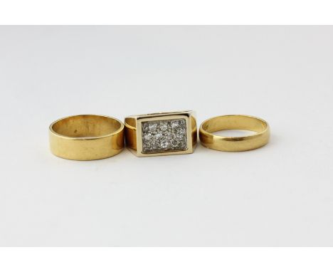 A 9ct gold ring pave set 6.6g; and two 22ct gold wedding rings 7.5g