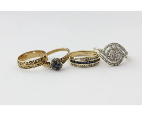 A diamond cluster ring in 9ct gold, a sapphire and diamond half hoop ring; a sapphire and diamond ring, and a white sapphire 