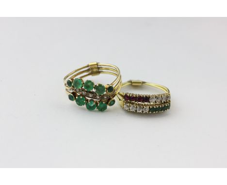 A three row ring set with blue and white sapphires, rubies and emeralds, and an emerald and white sapphire three row ring