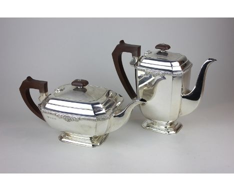 An Elizabeth II silver teapot and coffee pot with gadroon border and embossed shell and scroll detail, maker Garrard & Co, Bi