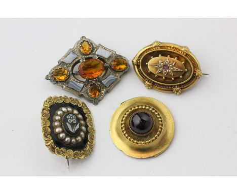 A Scottish hardstone and paste brooch; a Victorian gold, enamel and carved hardstone mourning brooch; a pearl and gem set bro