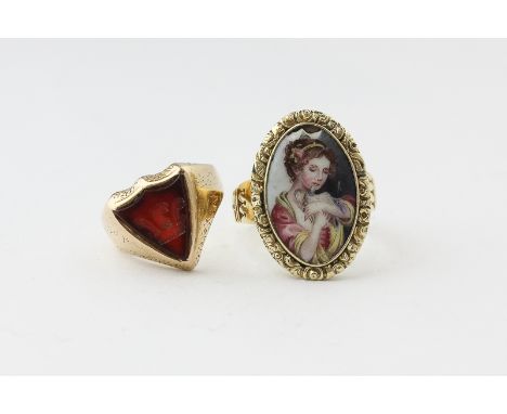 A Continental gold and enamel ring painted with a maiden and dove; a gold and cornelian signet ring